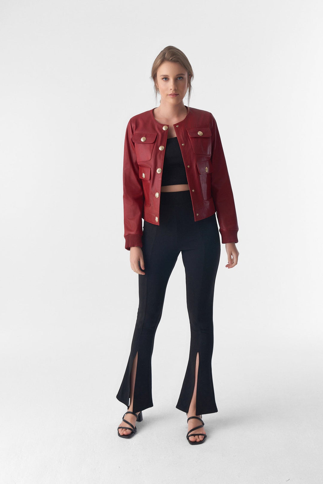 Woman wearing red cropped leather jacket