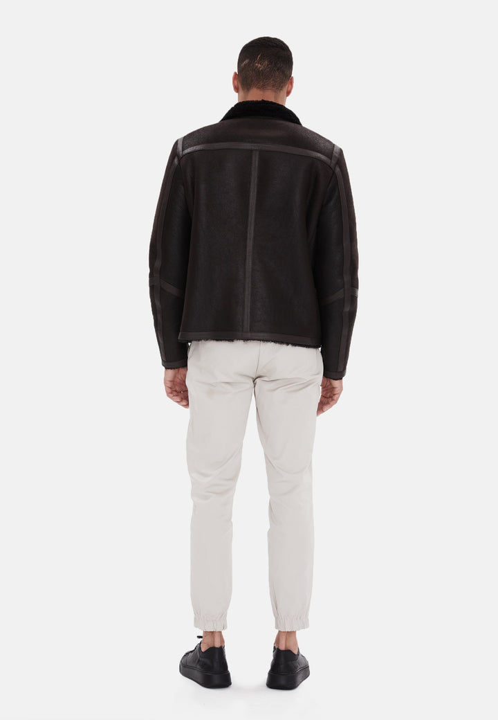 Man wearing black shearling jacket back