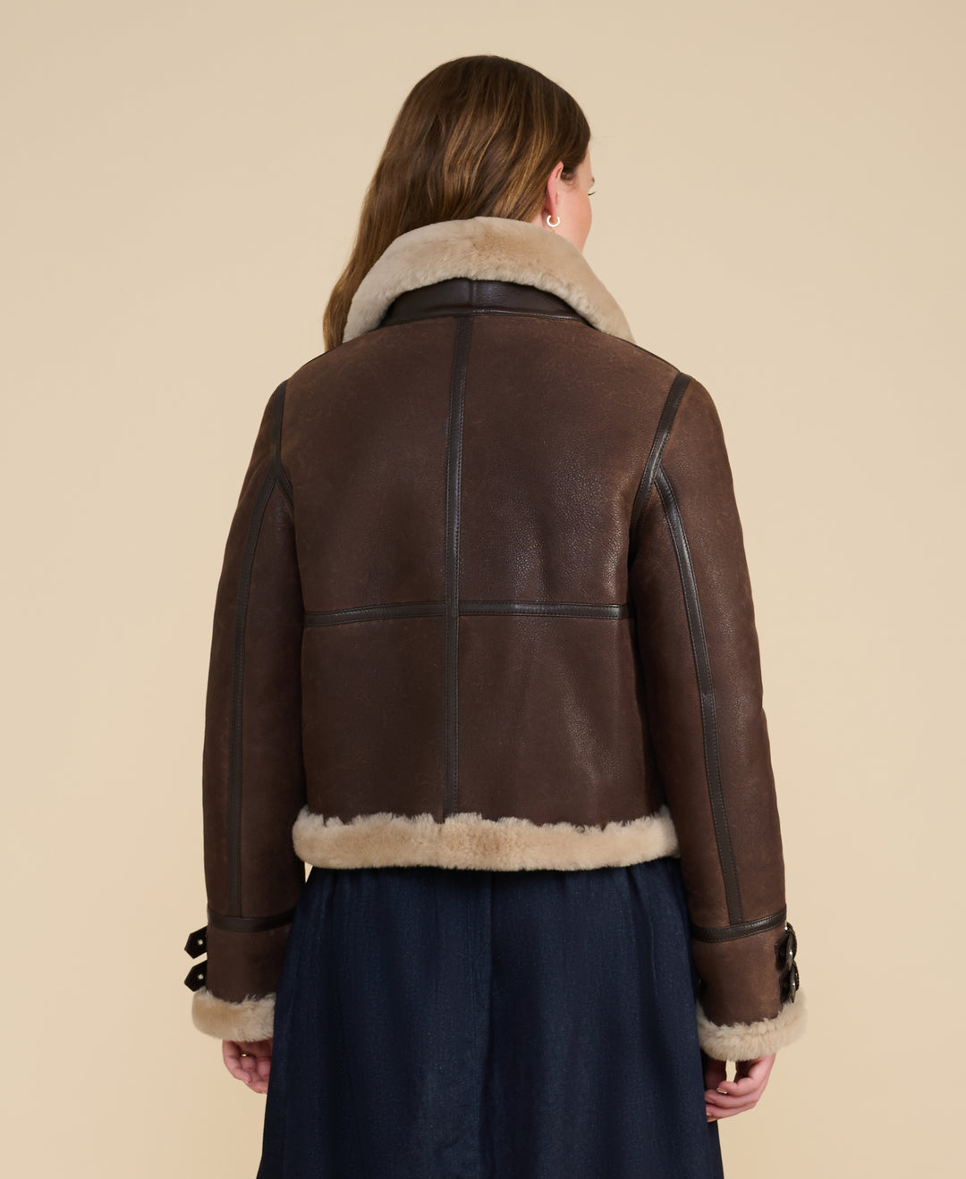 Back view of the Briar vintage brown sheepskin aviator jacket with cream shearling collar and hem trim