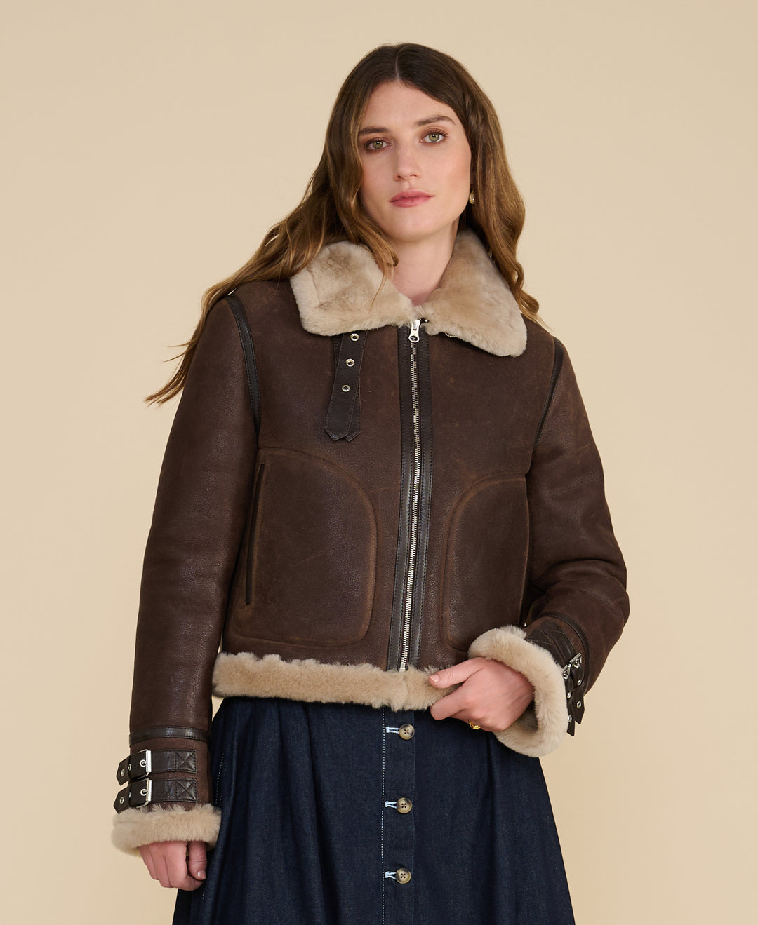 Front view of the Briar women's brown shearling aviator jacket with buckle cuffs and cream collar