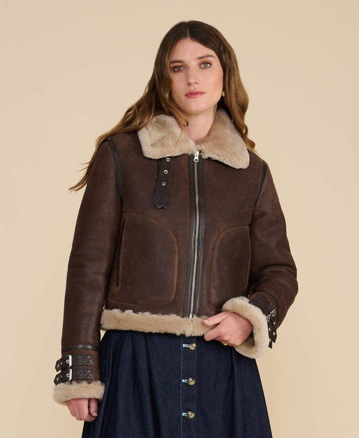 Front view of the Briar women's brown shearling aviator jacket with buckle cuffs and cream collar
