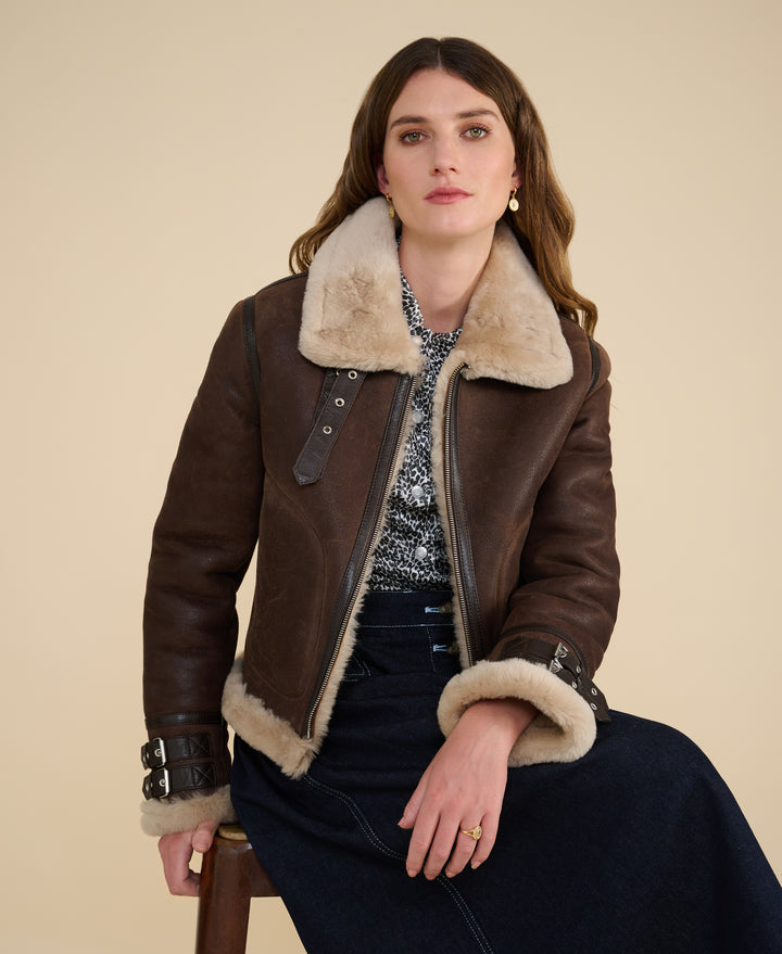 Briar women's cropped brown sheepskin aviator jacket styled open with natural cream shearling trim