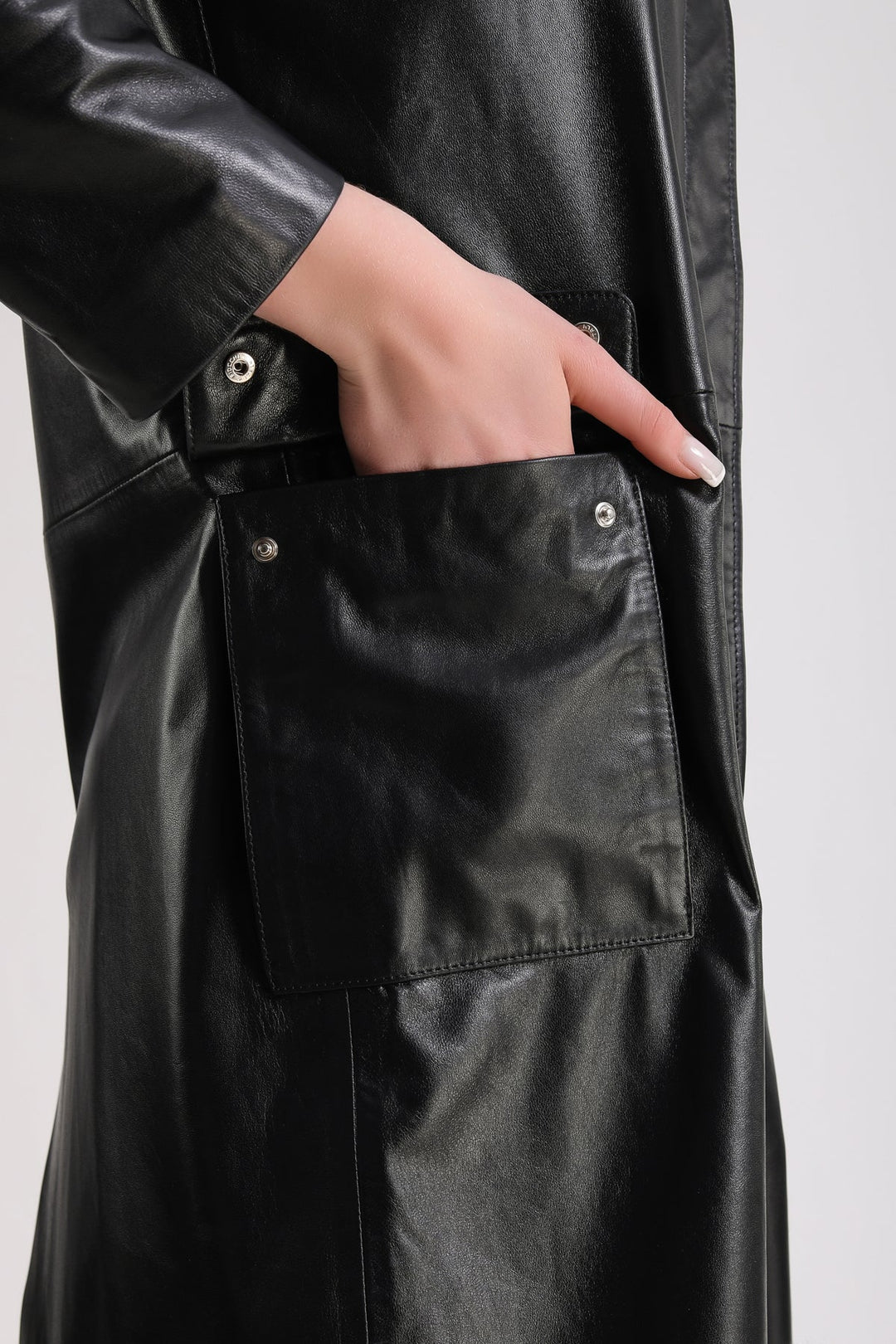 Black leather trench coat pocket