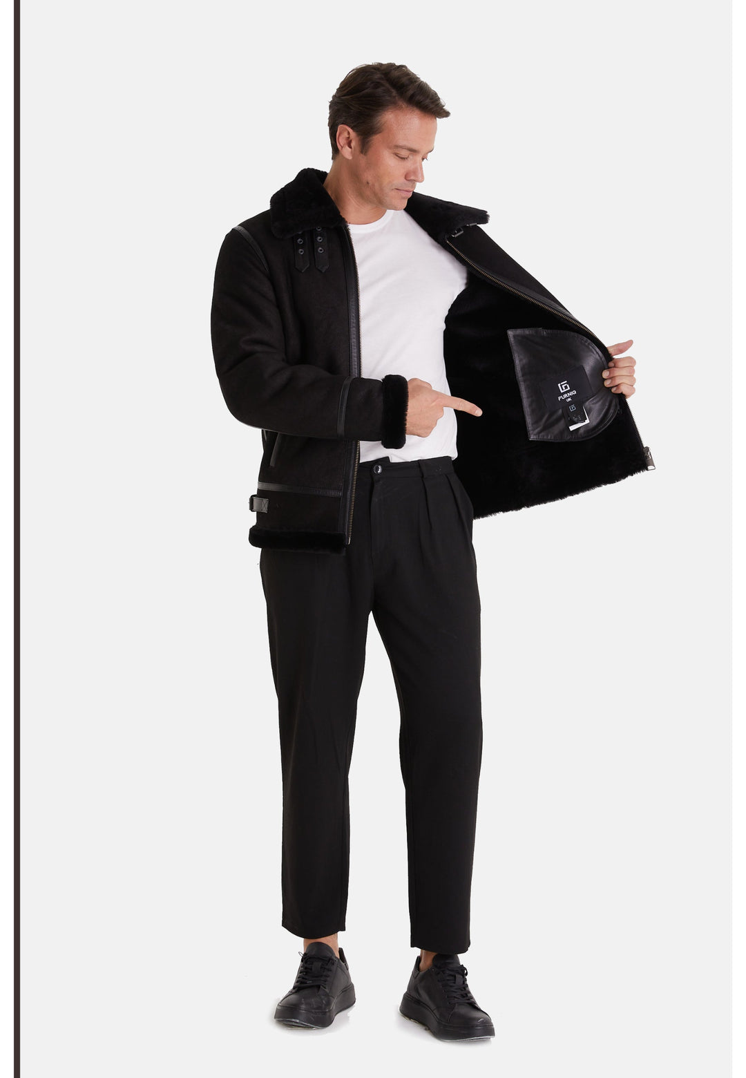 Man wearing black shearling aviator jacket