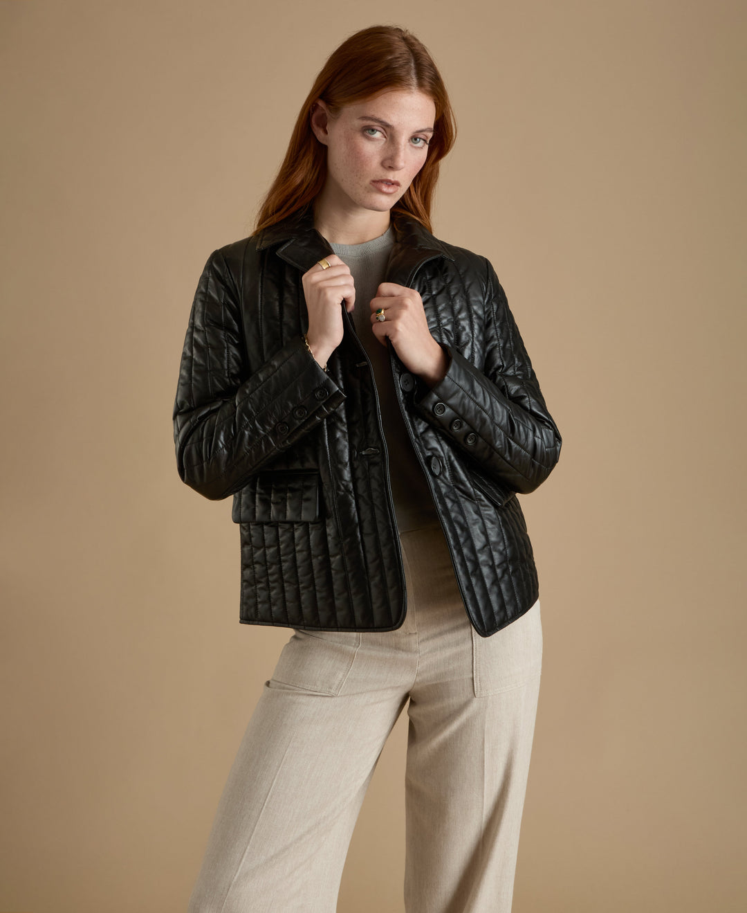 Woman wearing black quilted leather jacket