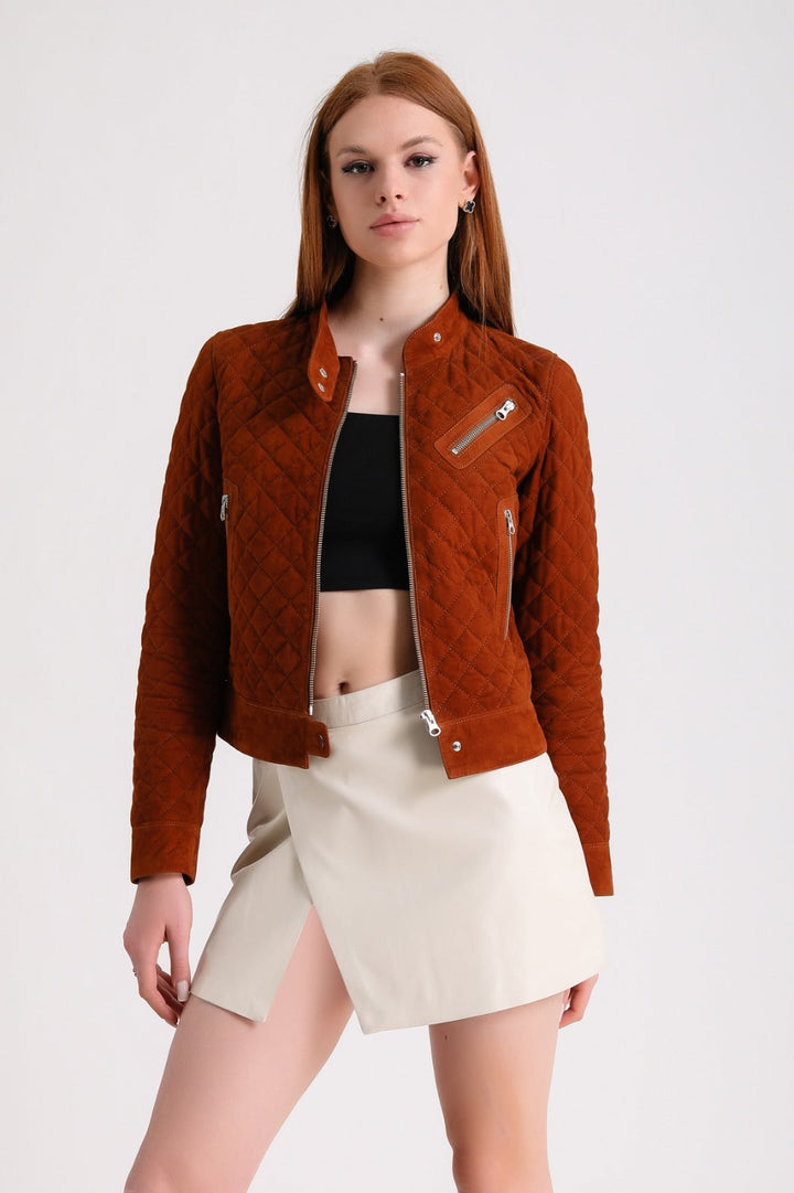 Woman wearing rust quilted suede jacket