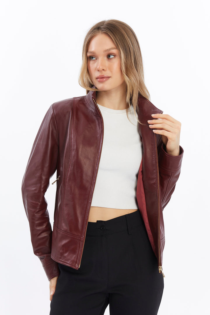 Woman wearing burgundy leather jacket