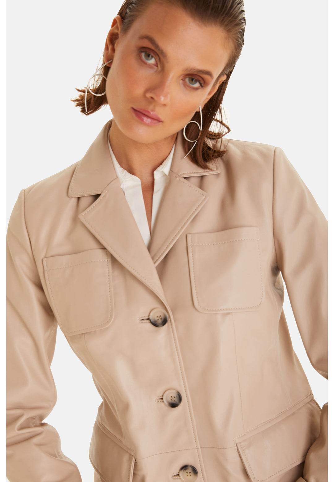 Beige leather blazer on model