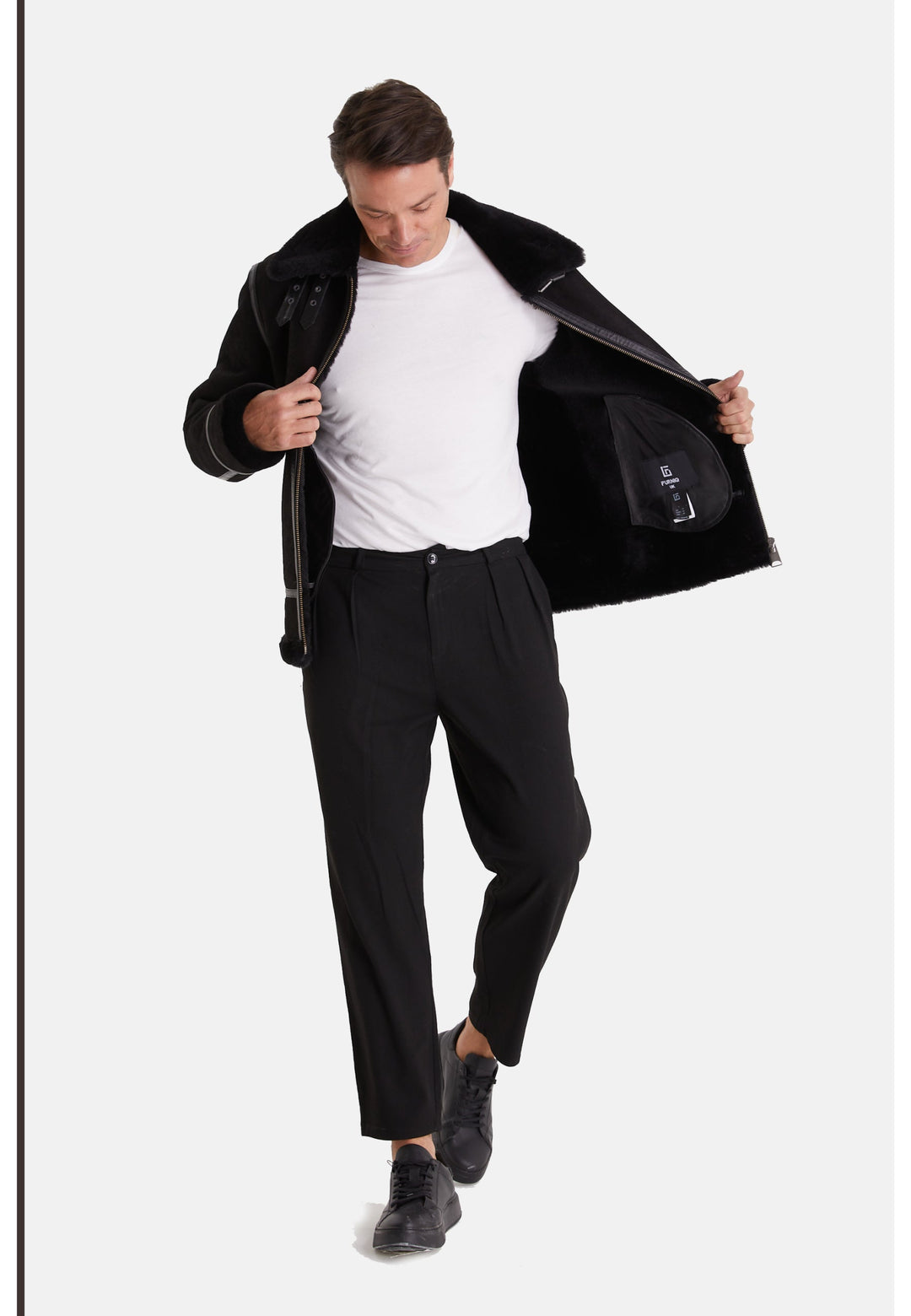 Man modeling black sheepskin aviator jacket