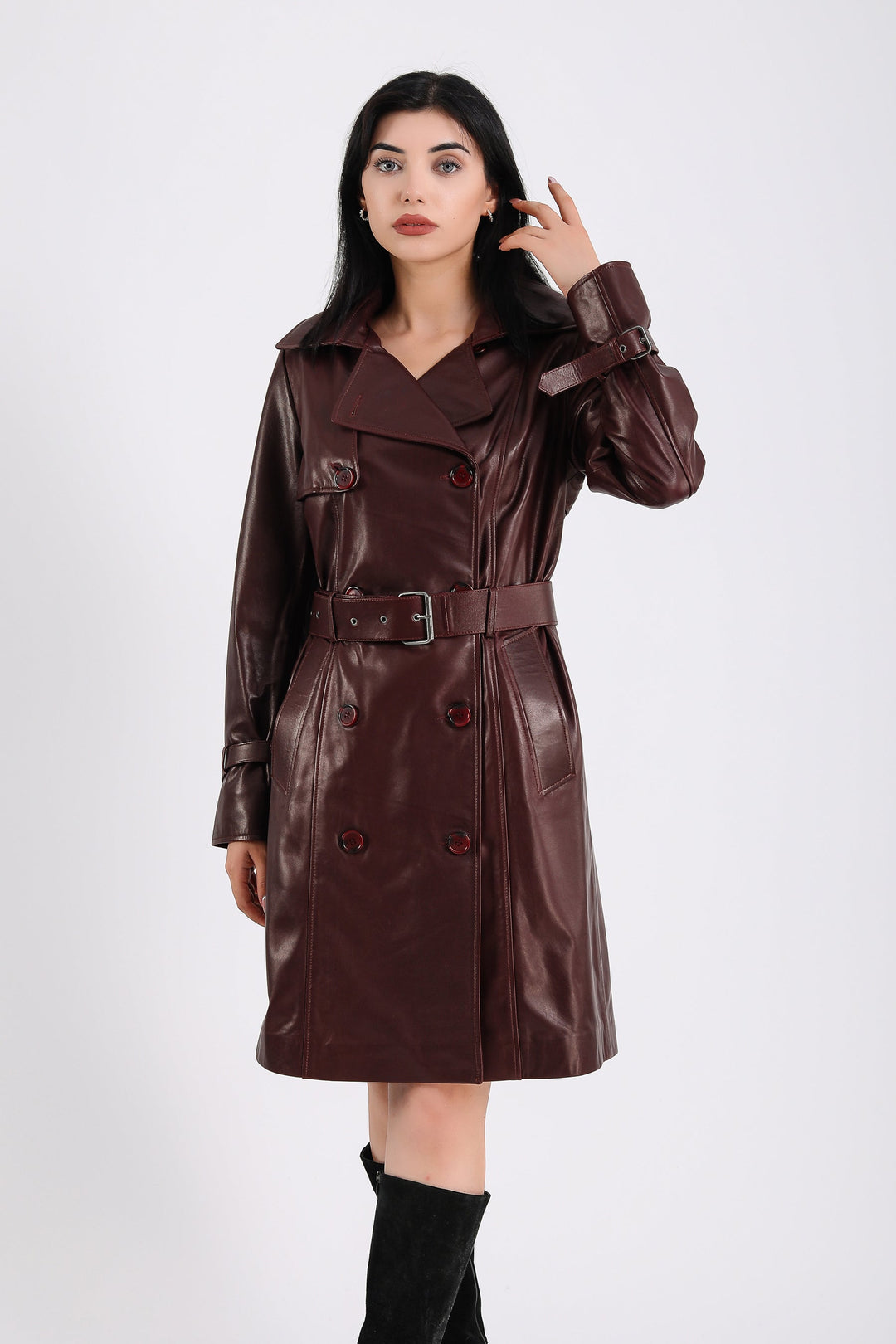 Woman wearing burgundy leather trench coat