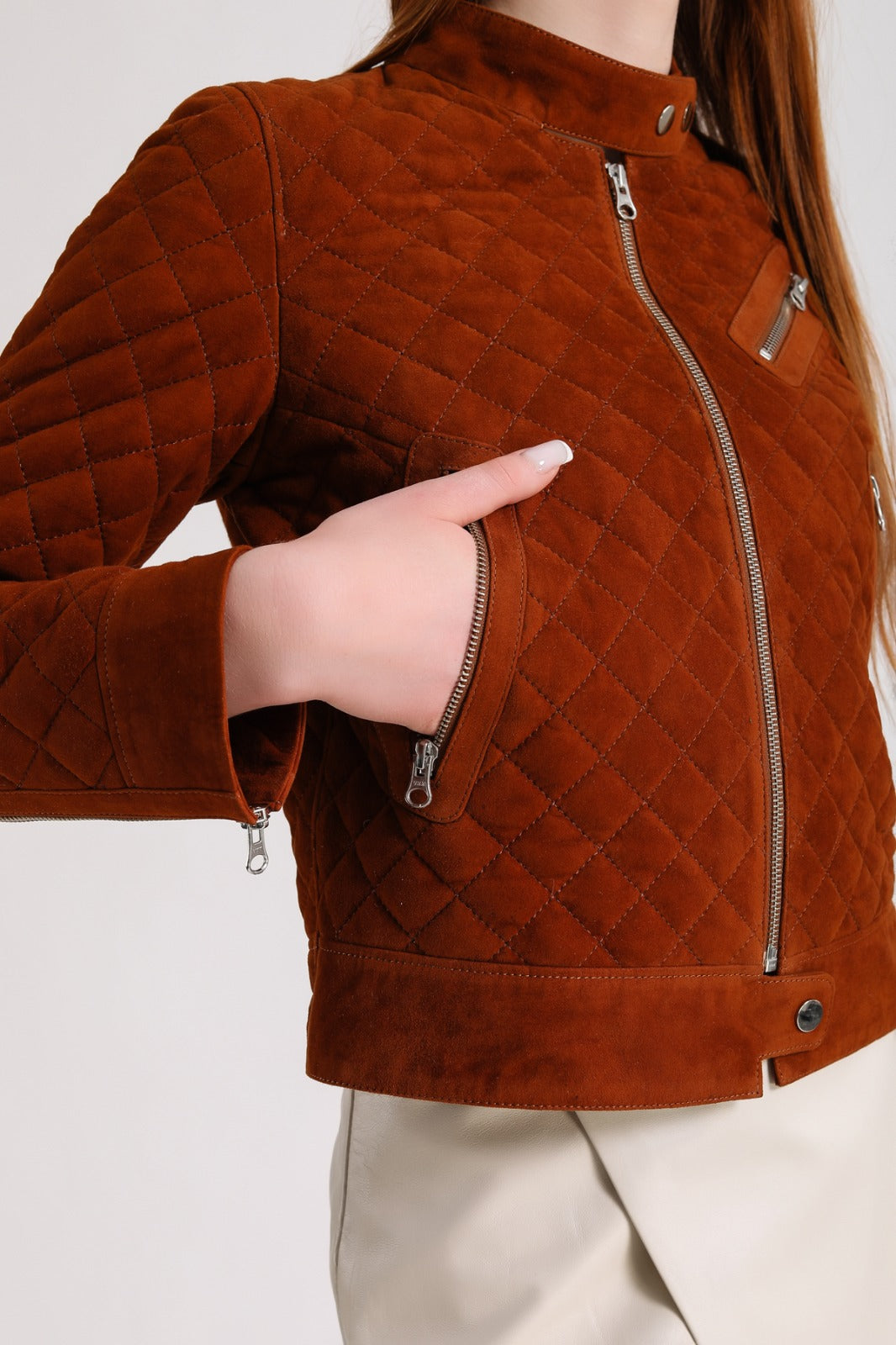 Brown quilted suede jacket close-up
