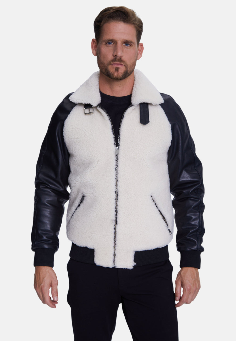 Man wearing black and white shearling jacket