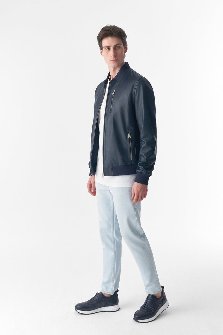 Man wearing navy leather bomber jacket