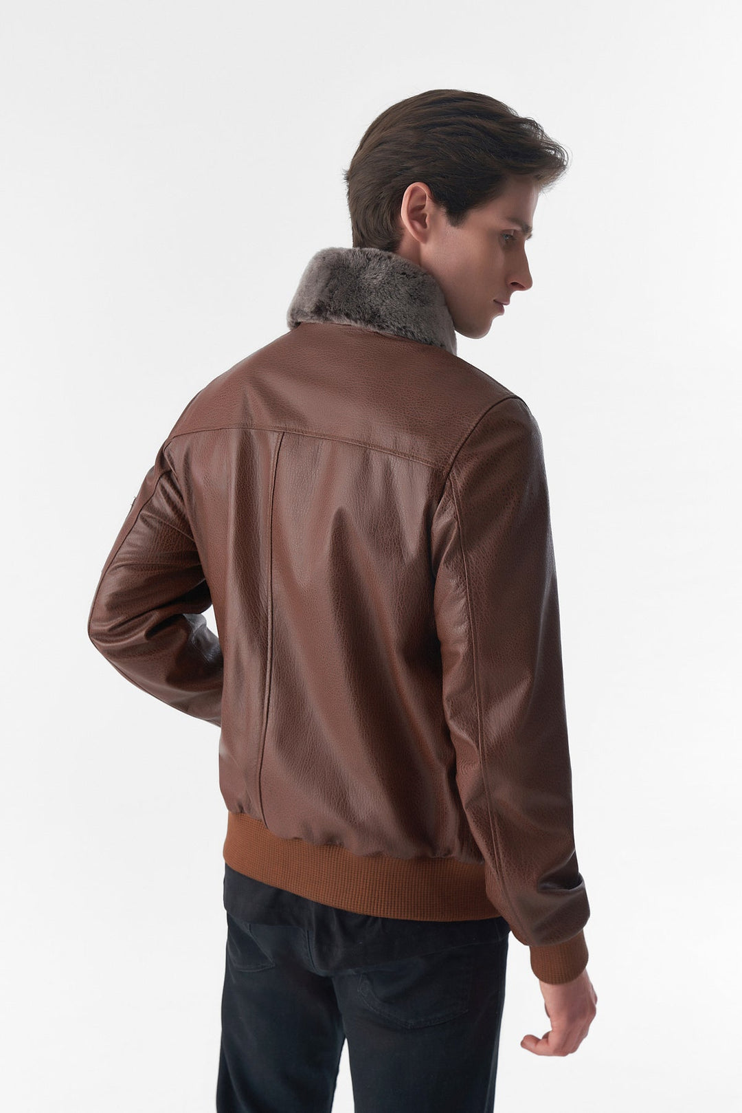 Man wearing brown leather jacket - back view
