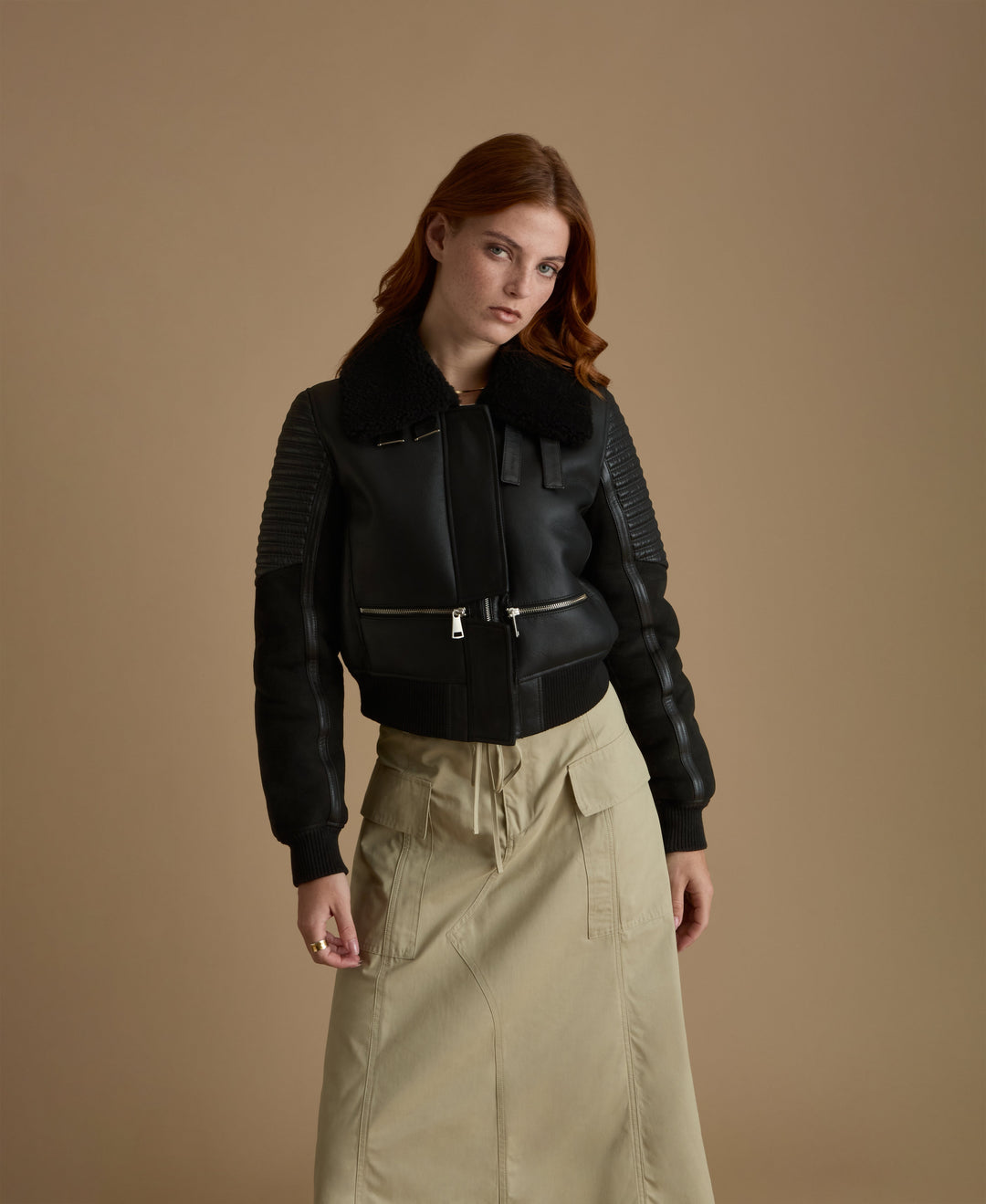 Woman wearing black shearling jacket