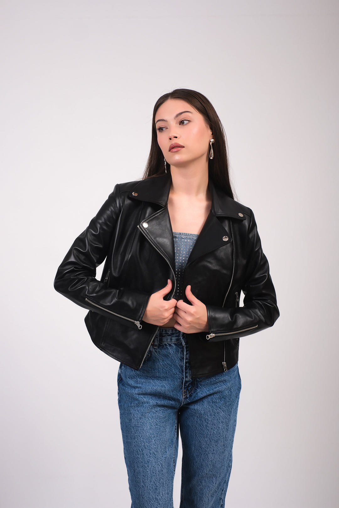 Charlotte women's black leather moto jacket styled open with denim