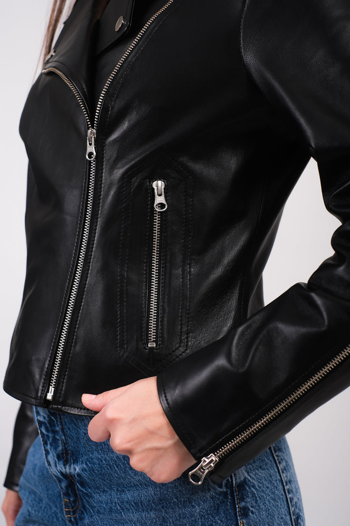 Charlotte black leather biker jacket showing silver zip pocket and cuff hardware