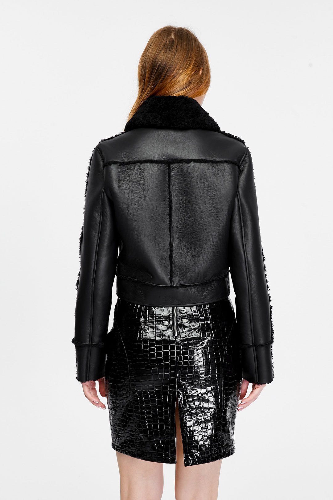 Back view of Clara black leather jacket with black curly shearling seam detailing