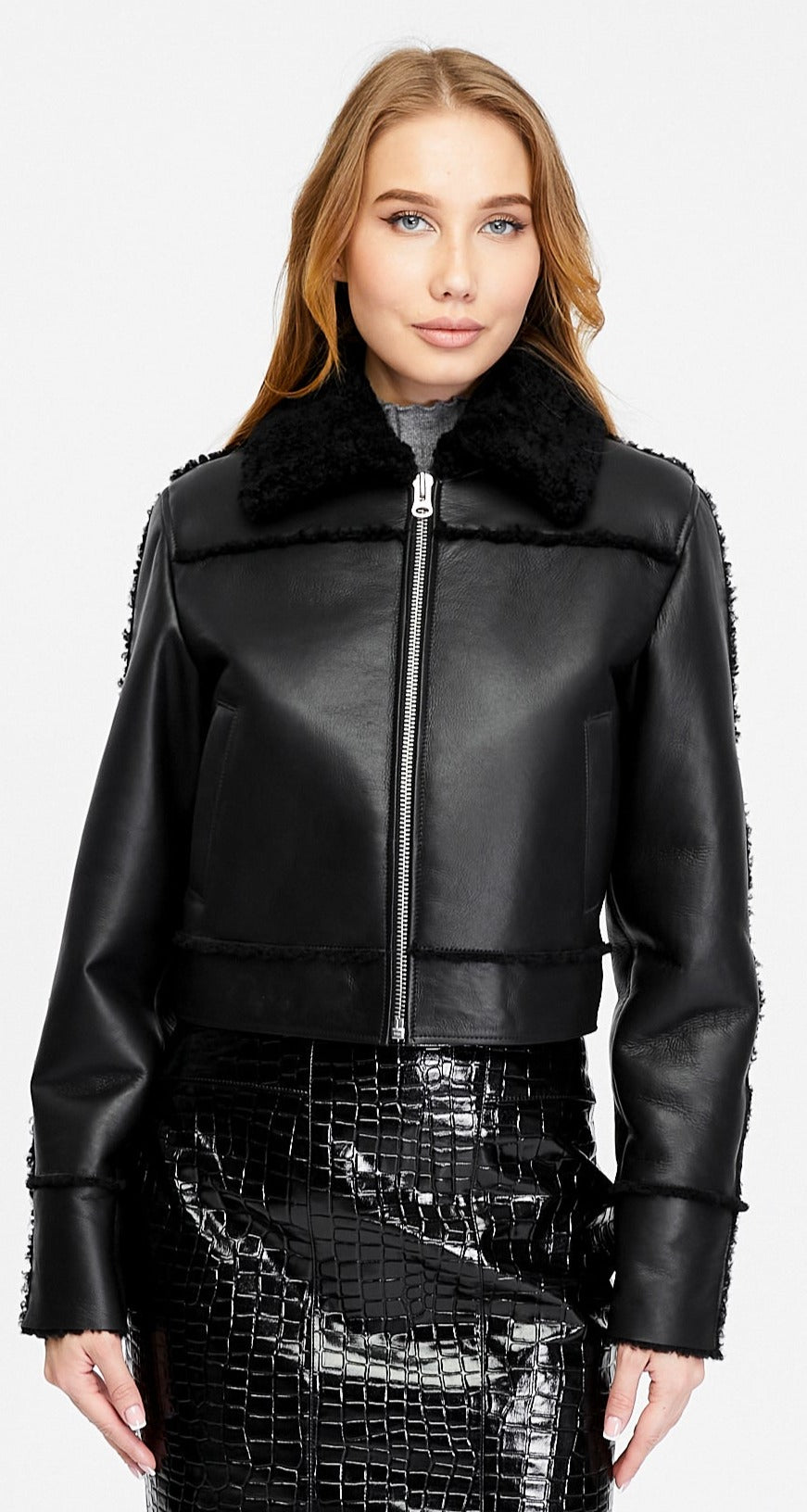 Clara black leather jacket with black curly shearling shown open to reveal the shearling interior