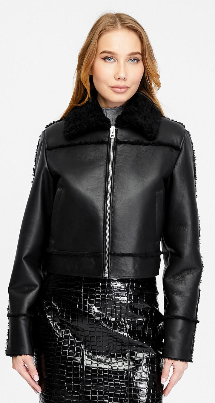 Clara black leather jacket with black curly shearling shown open to reveal the shearling interior