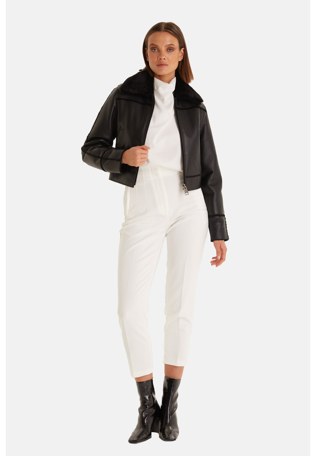 Clara cropped black leather and shearling jacket styled with white trousers