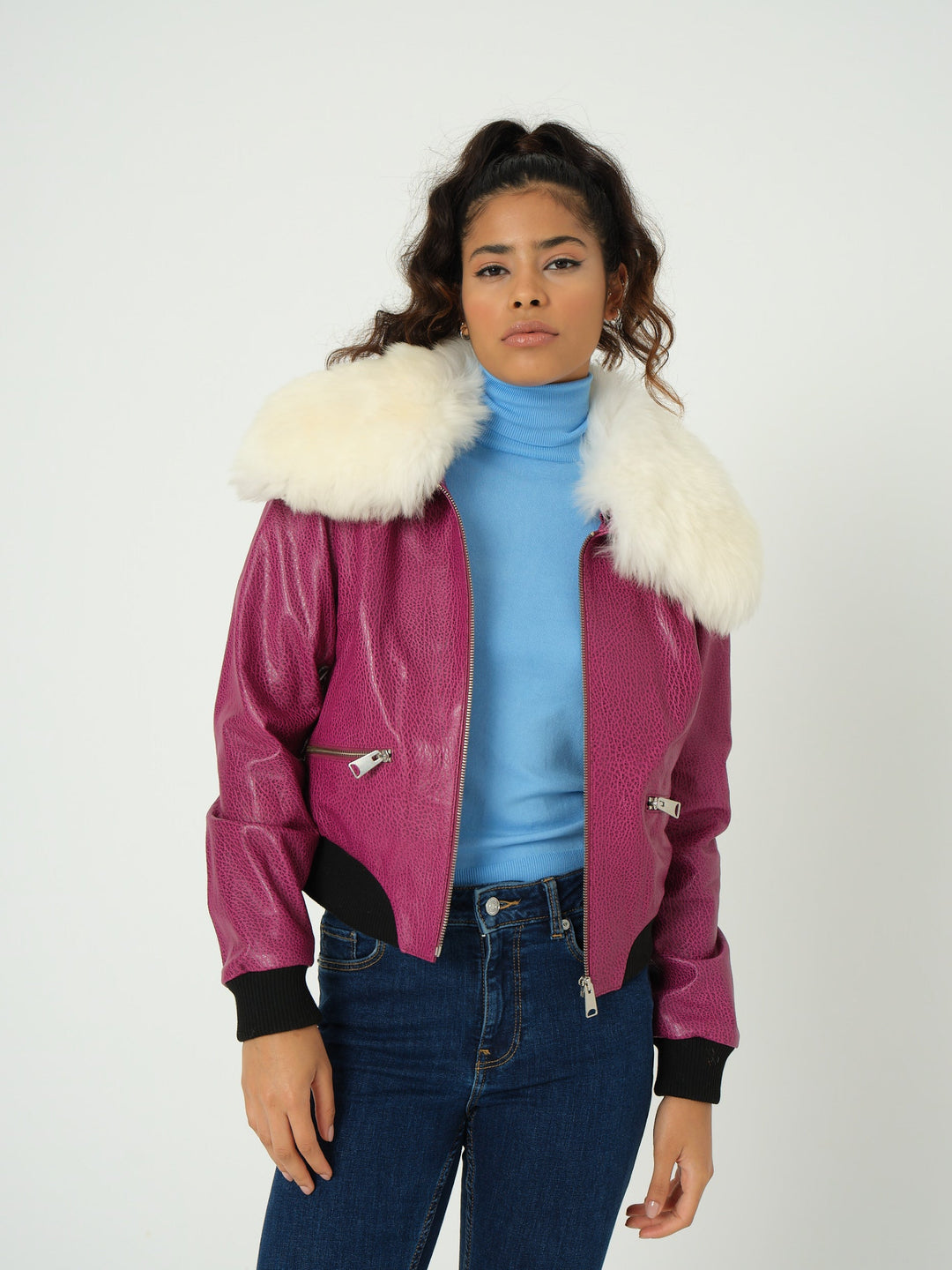 Woman in pink bomber jacket with white collar