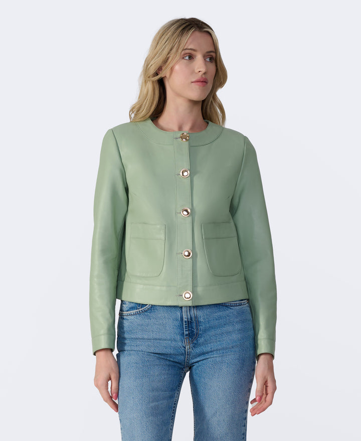 Woman wearing mint green leather jacket