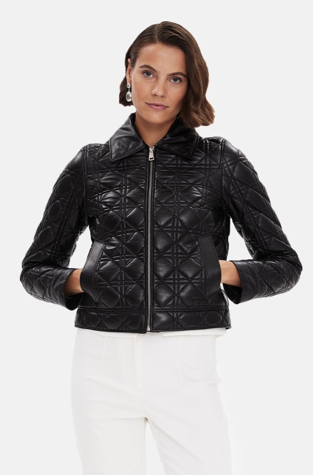 Woman wearing black quilted leather jacket