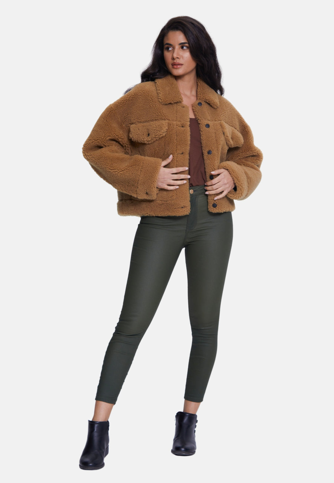 Woman wearing brown teddy jacket