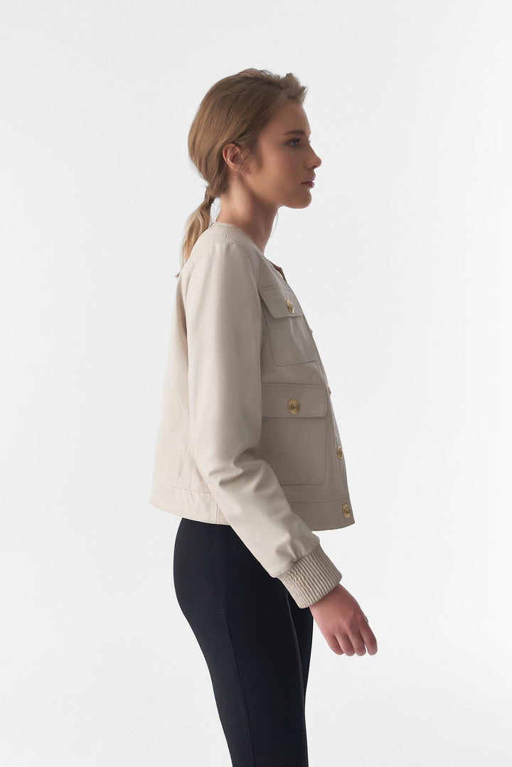 Woman wearing beige leather jacket