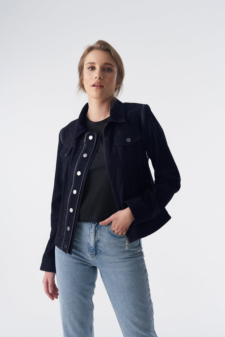 Woman wearing navy suede jacket