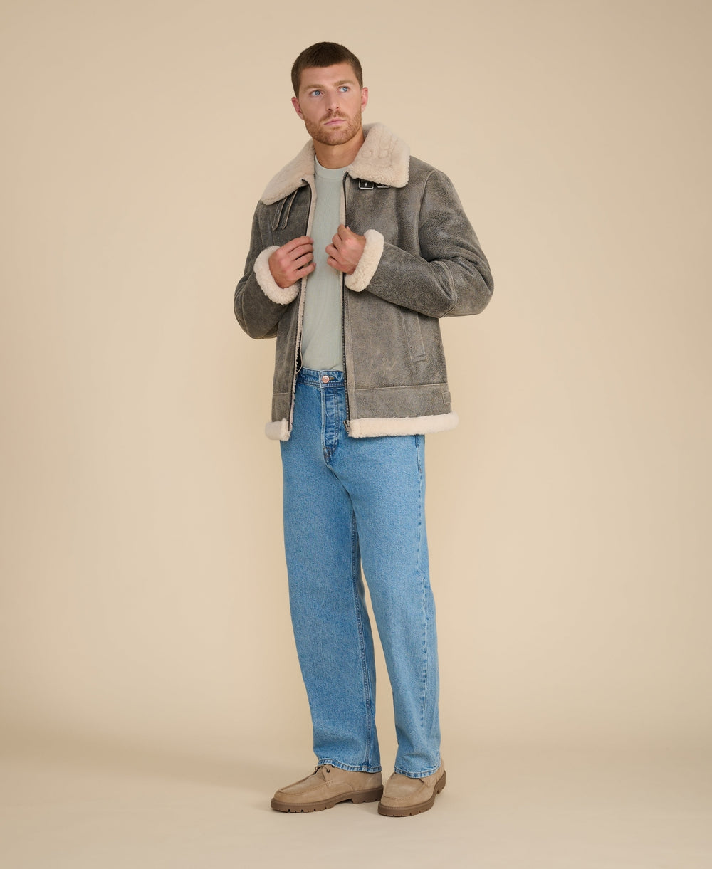 Man wearing shearling aviator jacket