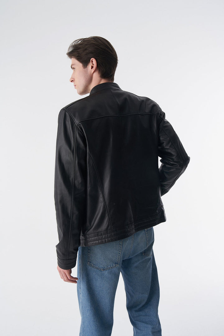 Man wearing black leather jacket back view