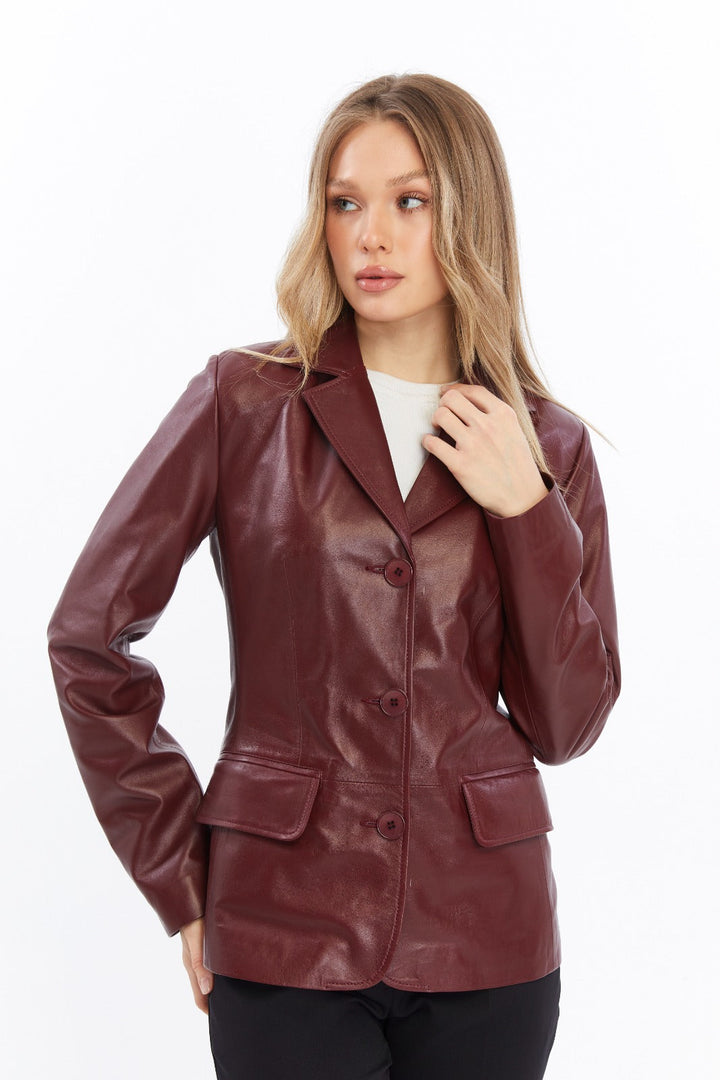 Woman wearing burgundy leather jacket