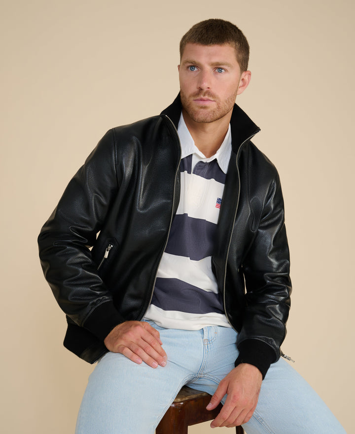 Male model wearing black leather zip jacket