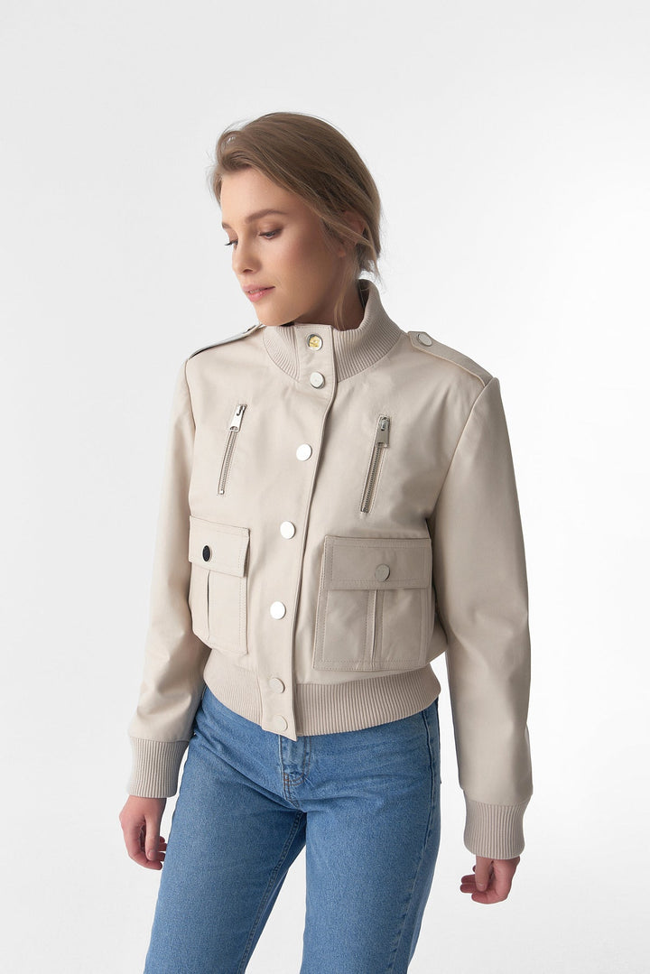 Woman wearing beige bomber jacket