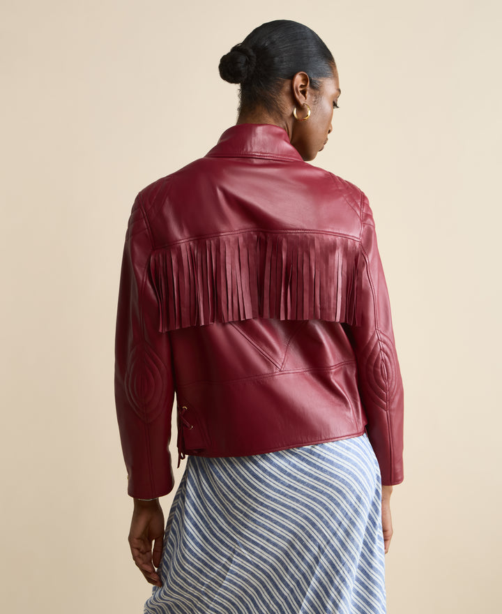 Back view of Dakota light burgundy fringed leather jacket with leather fringe detailing