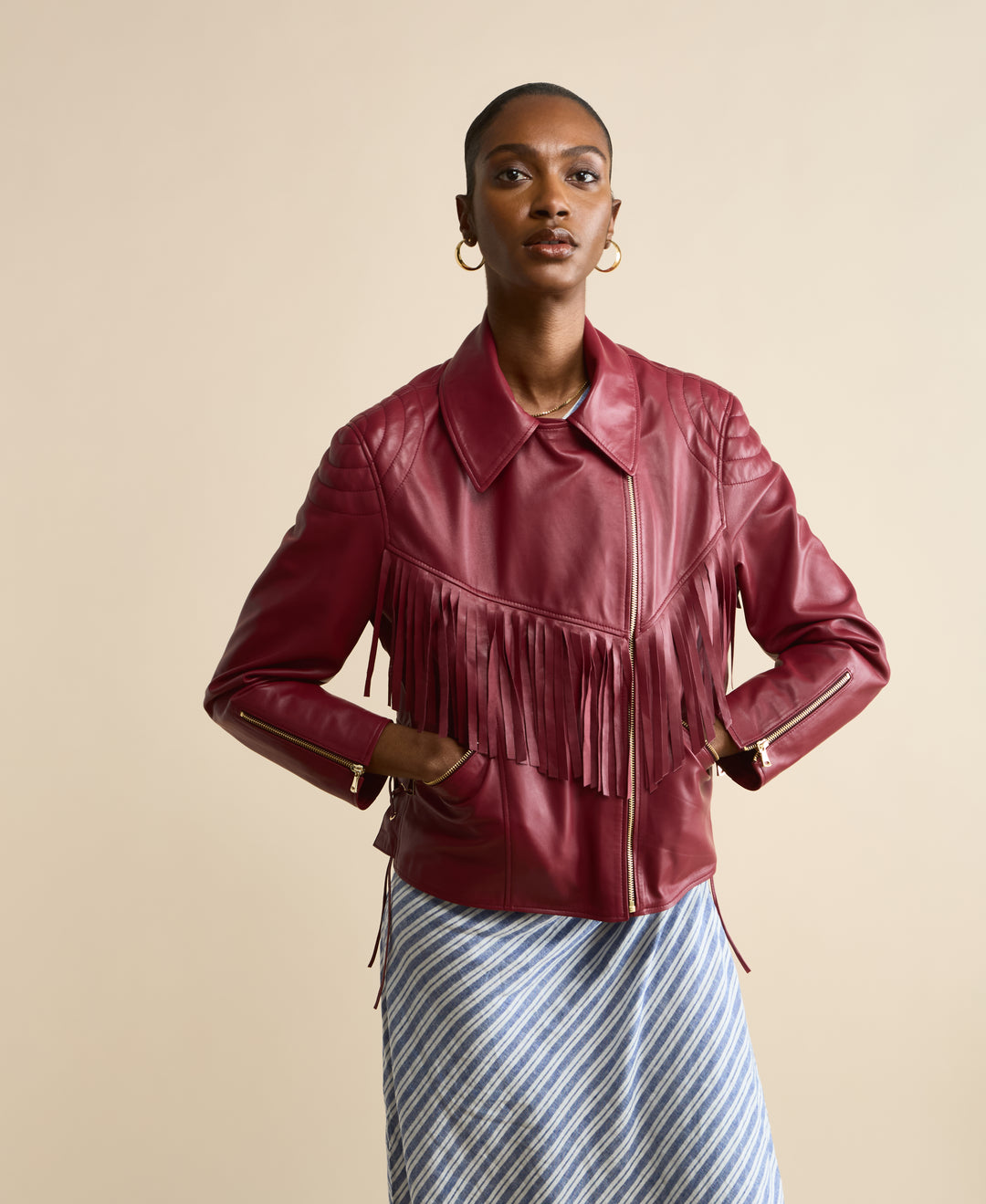 Front view of Dakota light burgundy fringed leather jacket with fringe detail