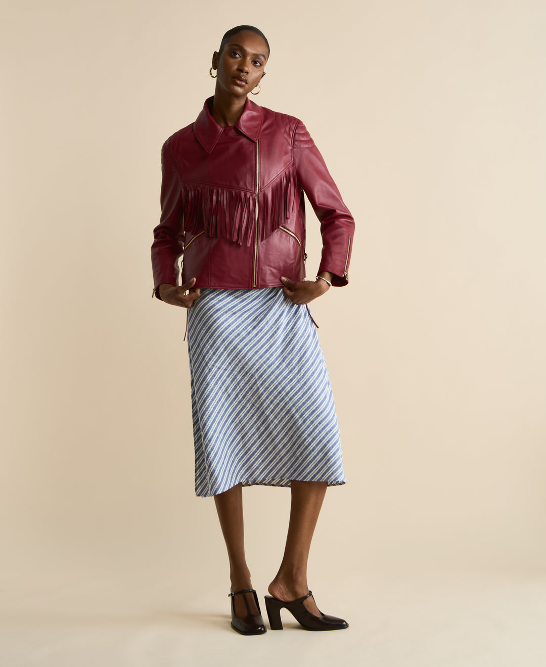 Model wearing Dakota light burgundy fringed leather jacket full length