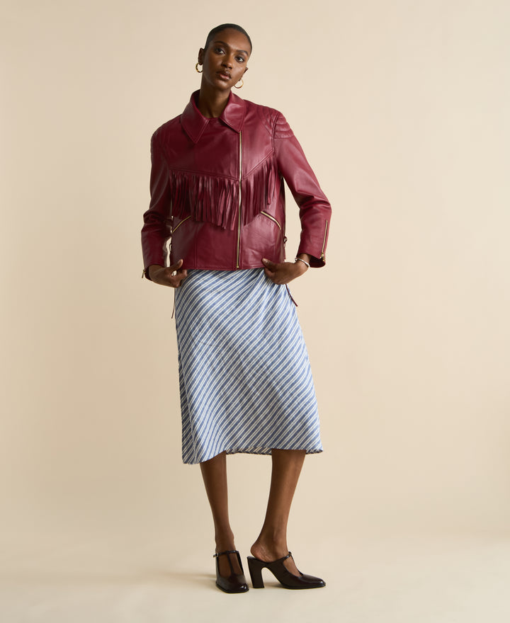 Model wearing Dakota light burgundy fringed leather jacket full length