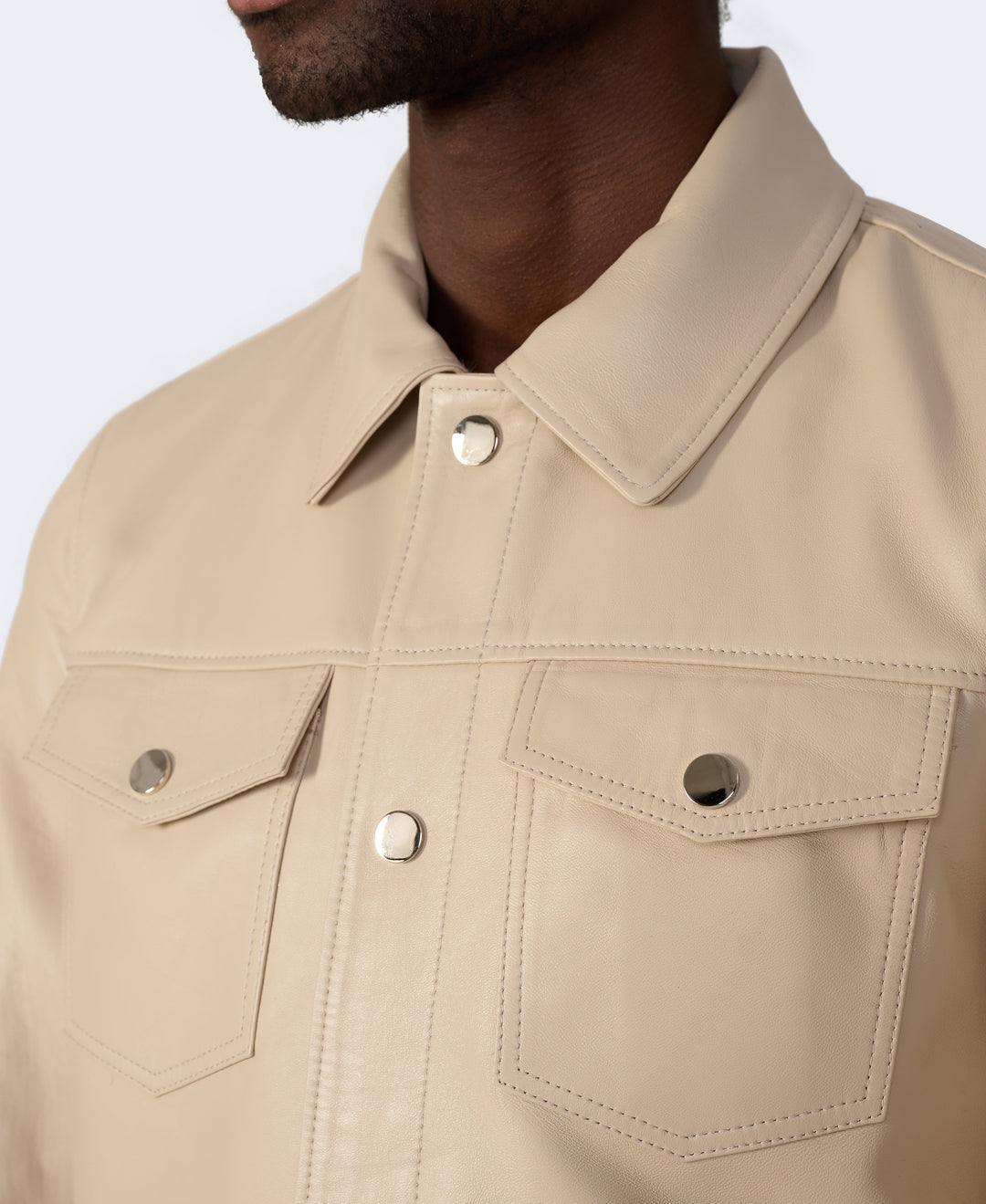 Beige leather jacket with snap buttons
