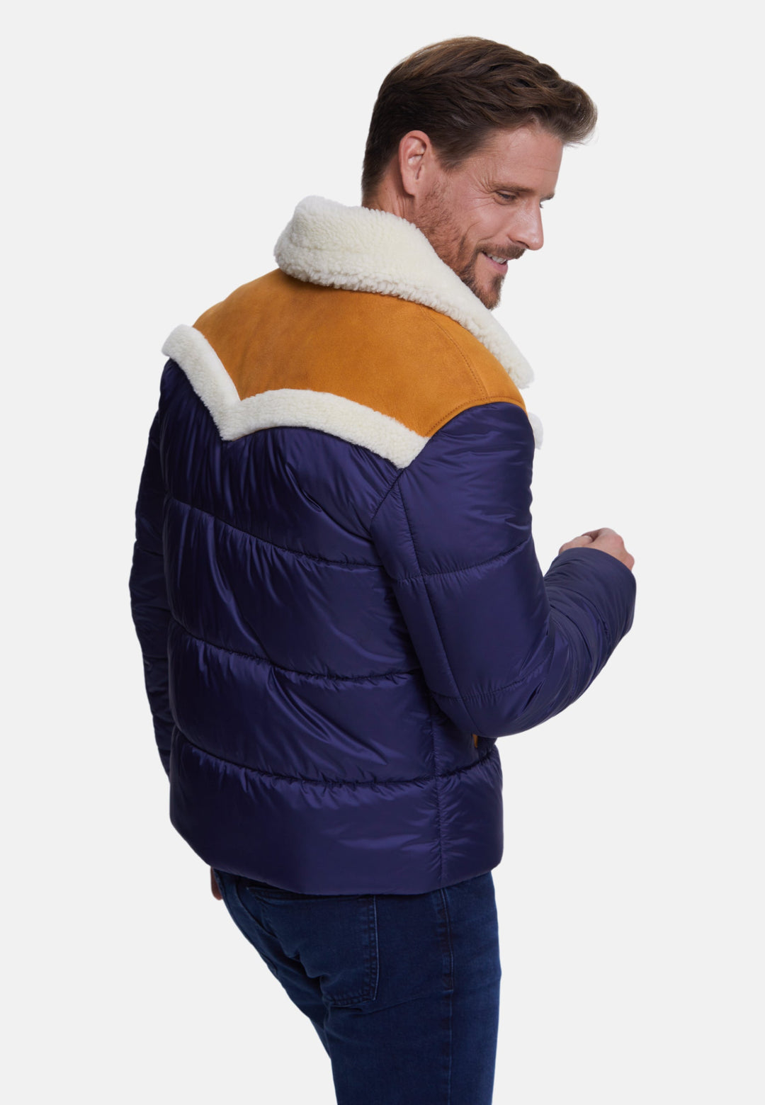 Man wearing navy and brown puffer coat