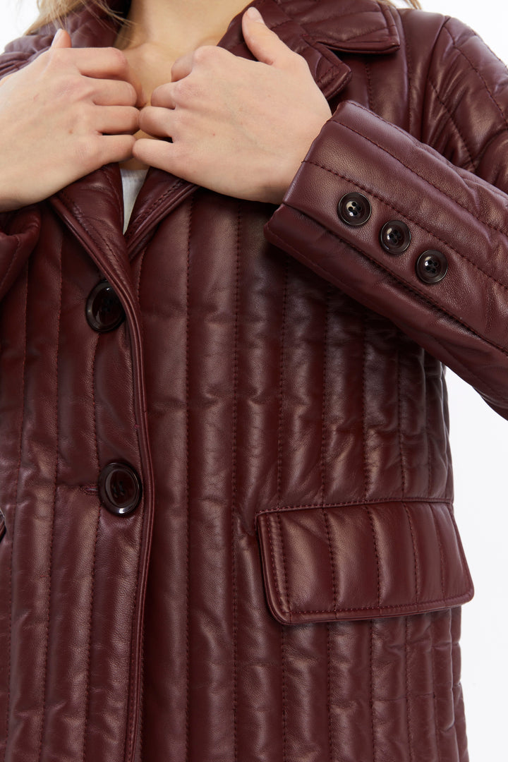Burgundy quilted leather coat close-up