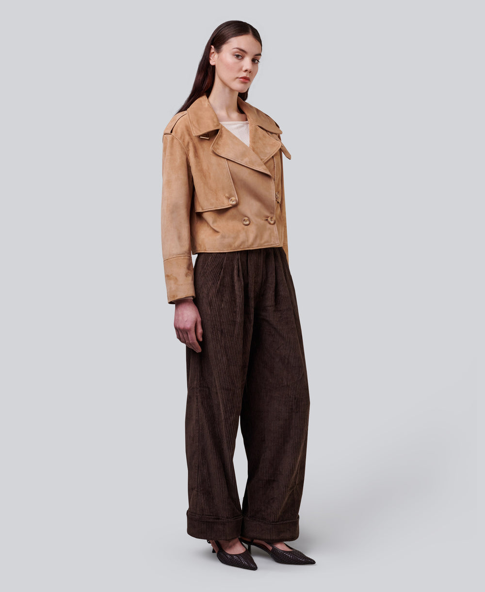 Tan cropped suede jacket on model