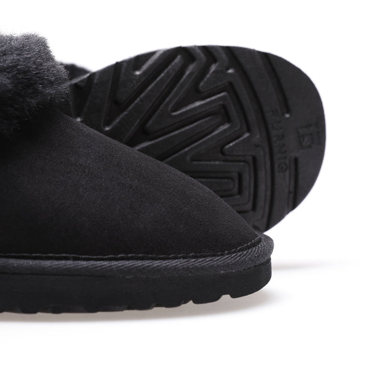 Black suede sheepskin slipper close-up
