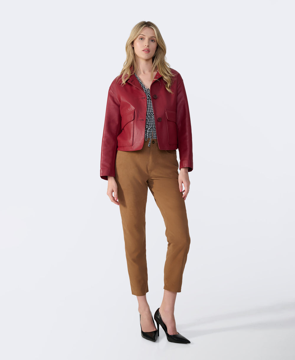 Woman wearing burgundy leather jacket
