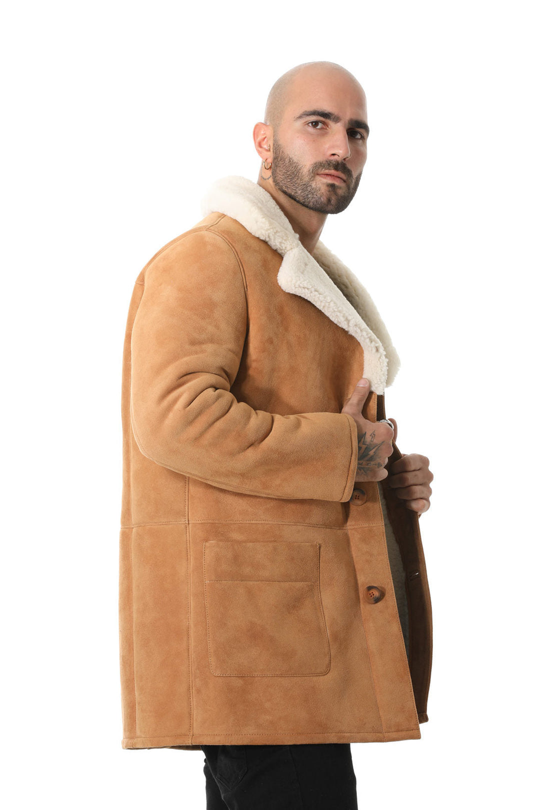 Man wearing tan sheepskin coat