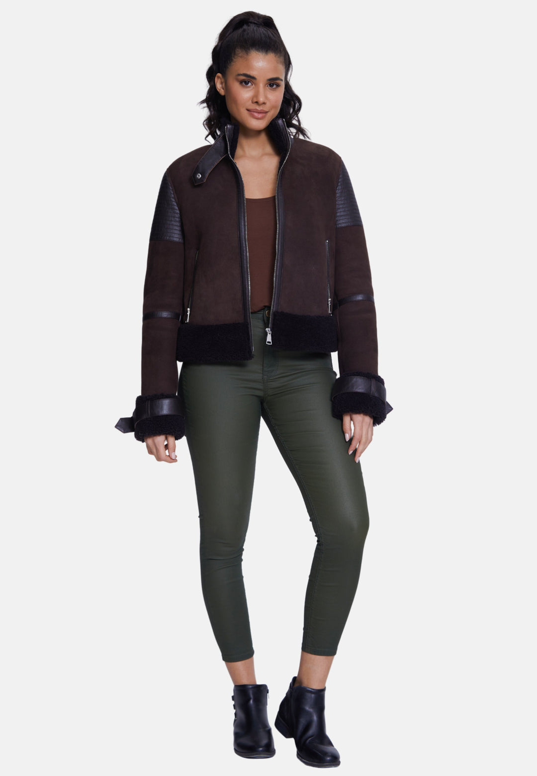Woman wearing brown sheepskin bomber jacket