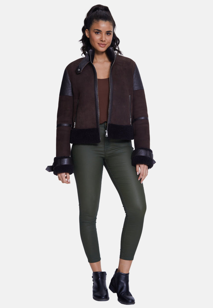 Woman wearing brown sheepskin bomber jacket