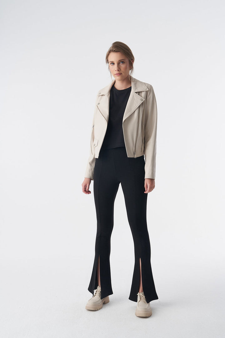 Woman wearing beige leather jacket